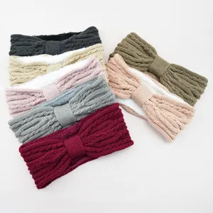 Fleece-lined knitted bow headbands detail showing soft texture and multiple warm winter colors.