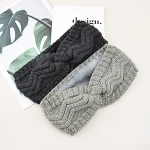 Cozy fleece-lined knitted twist headband, thick wool winter ear warmer for cold weather.