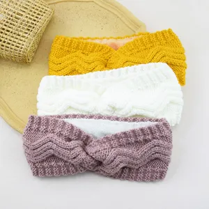 Knit fleece-lined headband detail showing texture, color wave pattern and soft inner plush.