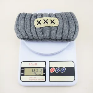 Grey knitted hair band for women, wide winter warm fleece headband with embroidered patch.