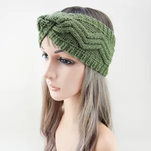 Dark green knit headband detail view, cozy wool ear warmer featuring twisted cross design.