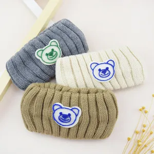 Knit bear headband detail shot, soft plush hair accessory for daily wear and washing.