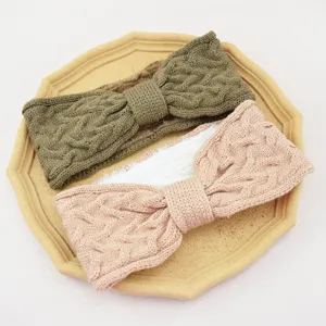 Knitted fleece-lined bow hairband detail shot showing soft woolen texture and cozy warm lining.