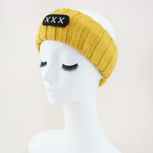 Yellow knitted hair band with black embroidered patch, comfortable wide brim face wash headband.