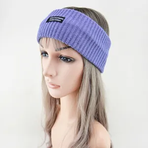 Purple knitted wide hairband with stylish slogan label, soft and comfortable for daily wear.