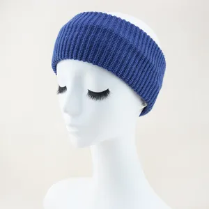 Detailed view of the blue knitted ribbed hair band, showcasing the fine texture and cozy fabric.