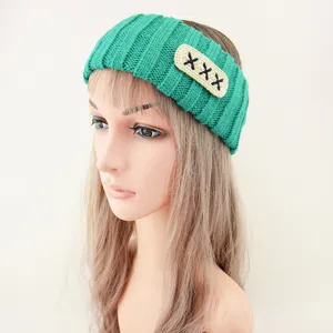 Green knitted headband detail, featuring cute embroidered text, perfect for daily washing and hair styling.