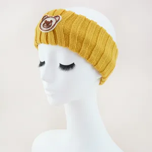 Yellow knitted headband with cute bear embroidery for women daily wear and face washing details