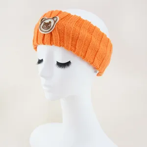 Orange knitted headband for women, cute bear patch hair hoop, soft wide winter hair accessories.