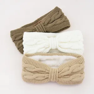 Knitted fleece-lined bow headband, thick warm winter ear warmer hair accessory for women.