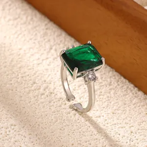 Detailed close-up of the vintage green zircon open ring, showing exquisite square gemstone.
