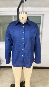 Details of a classic blue and black plaid long-sleeve shirt with lapel and button closure.