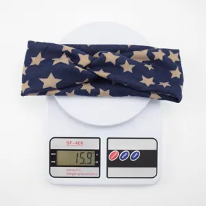 Navy blue star print twist headband for women, stylish fabric hair band for yoga and sports.