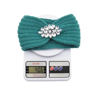 Detail shot of the sparkling rhinestone knit headband on a digital scale showing weight.