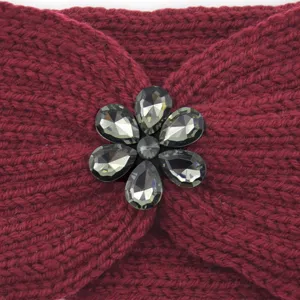 Close-up view of wine red knit headband featuring a sparkling rhinestone flower detail.
