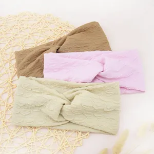 Details of stylish twist bubble fabric headbands in three soft colors for daily wear.