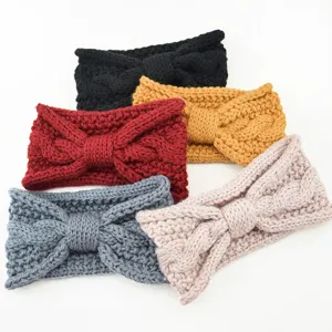 Detailed view of handmade knitted bow headbands in multiple warm colors for autumn/winter daily wear.