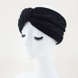 Black knitted twist headband cozy fleece-lined ear warmer winter hair accessory.