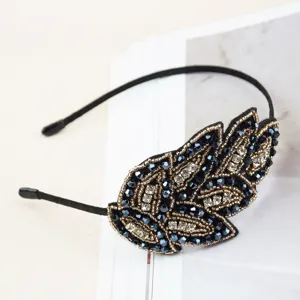 Exquisite handmade crystal leaf headband with sparkly rhinestones and elegant beaded details.