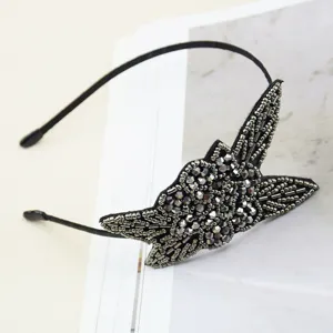 Handmade beaded crystal hairband detail shot showing intricate rhinestone embellishment.