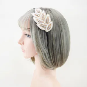 Detailed side view of handmade beaded leaf crystal headband, elegant alloy hair accessory.