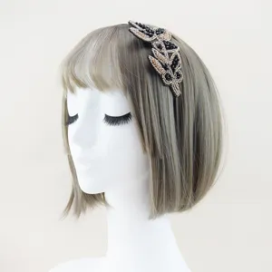 Handcrafted crystal rhinestone leaf headband, elegant alloy hair hoop accessory for women.