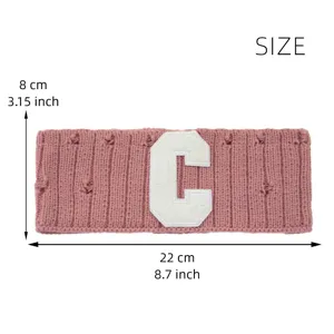 Knit headband with letter C patch, distressed design, 22x8 cm cozy winter hair accessory.