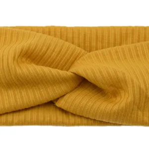 Yellow ribbed twisted headband for women, elastic knit hair band, breathable sports style.
