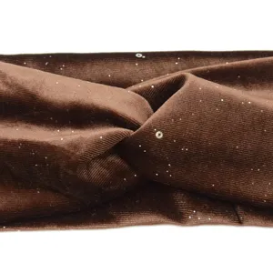 Brown velvet twisted headband detail shot, showing soft fabric texture and subtle sparkles.