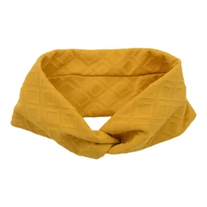 Yellow twisted headband for women, stylish geometric diamond waffle pattern athletic hair band.