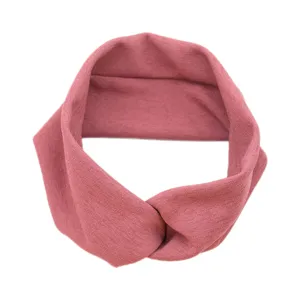 Pink knotted athletic headband, breathable stretch fabric for yoga, sports and daily face wash.