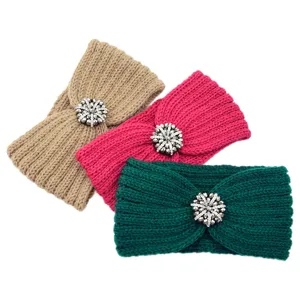 Detailed view of cozy knitted winter headbands with sparkling rhinestone snowflake embellishments.