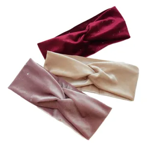 Velvet twist headband detail view showing multiple colors of elastic hair bands for sports and yoga.