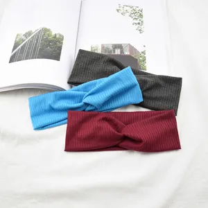 Ribbed knotted headband set featuring breathable stretchy fabric in charcoal, blue and red.