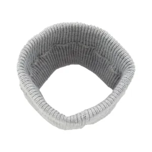 Detailed view of grey knitted hairband, soft ribbed texture elastic sports accessory.