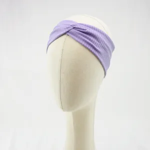 Lavender ribbed twisted fabric headband detail view, soft and stretchy everyday hair accessory.