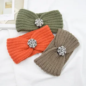 Chic knitted winter headbands featuring sparkling rhinestone flower embellishments in multi colors.