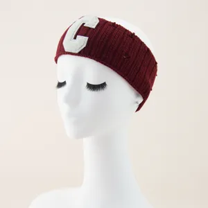 Burgundy knitted headband with white C letter patch, soft wool hairband for sports yoga.