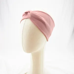 Pink cloth knotted headband for daily wear, soft and elastic fabric detail shot.