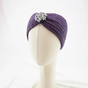 Purple knitted headband with sparkling rhinestone buckle, winter warm hair accessory detail.