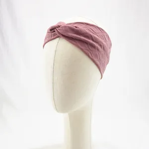 Dusty pink knotted athletic headband, breathable diamond pattern yoga hair band detail.