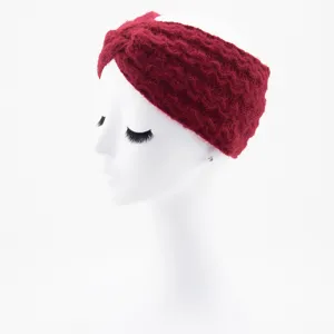 Close up of red knit headband, cozy plush winter hair accessory and warm ear warmer detail.