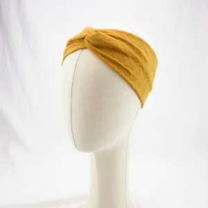 Detailed shot of yellow geometric diamond knit cross headband for women sports and yoga fitness.