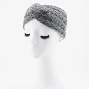 Grey knitted cross headband detail view, soft woolen winter hair accessory ear warmer.