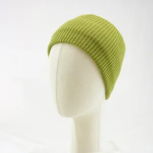 Green knit beanie cap detail view, warm winter woolen hat for daily wear and outdoor style.
