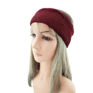 Detailed display of a dark red knitted hairband featuring hollow texture on a white background.