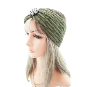 Green knitted headband with rhinestone detail, warm winter hair accessory for women.