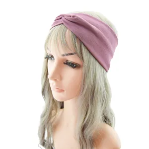 Detail view of a purple knotted fabric headband, perfect for yoga, sports, and daily skincare.