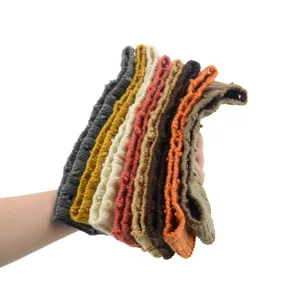 Detailed view of colorful knitted headbands, soft wool hair accessories for yoga and sports wear.