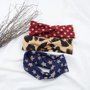 Fabric cross headband set with polka dot, leopard and star print for sports and yoga.